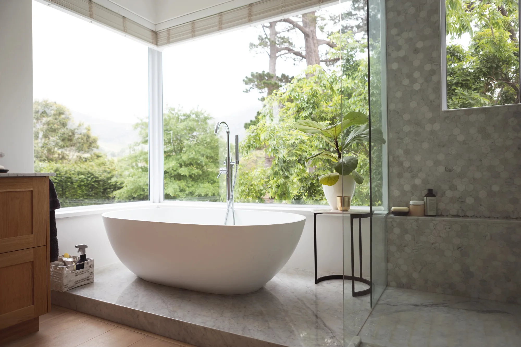 Custom-designed freestanding tub bathroom with garden window view