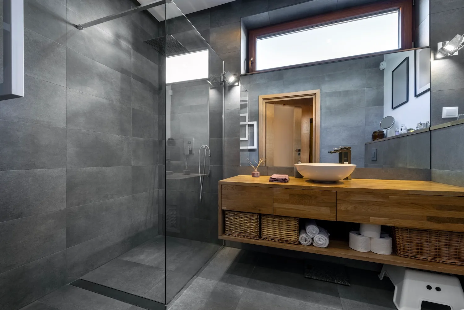 Walk-in shower ensuite with timber vanity and vessel sink
